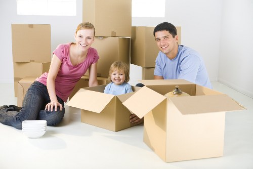 Moving team loading furniture safely with protective equipment