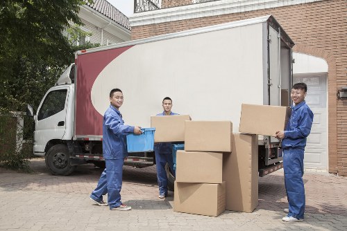 Local removal team loading furniture in a Bromley residential street