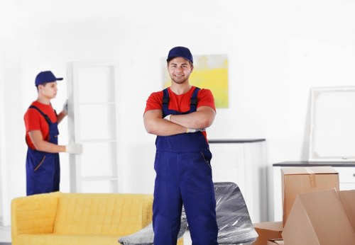 Professional movers coordinating a safe relocation procedure