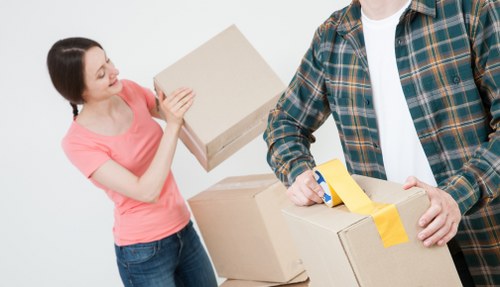Office removal team handling desks and boxes in Bromley