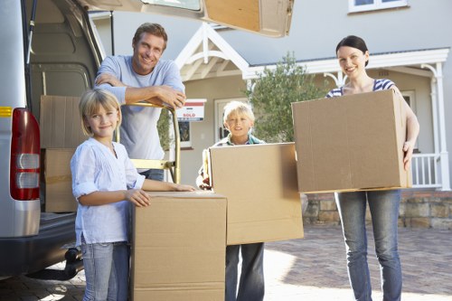 Specialist movers handling a piano in a Bromley property