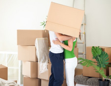 Mover handling furniture carefully during a home relocation