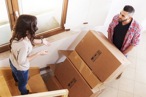 Efficient Bromley movers unloading belongings at a new property