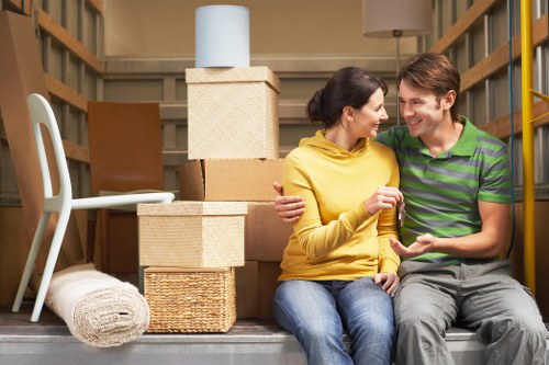 Furniture and packed boxes arranged for a cubic-yard estimate